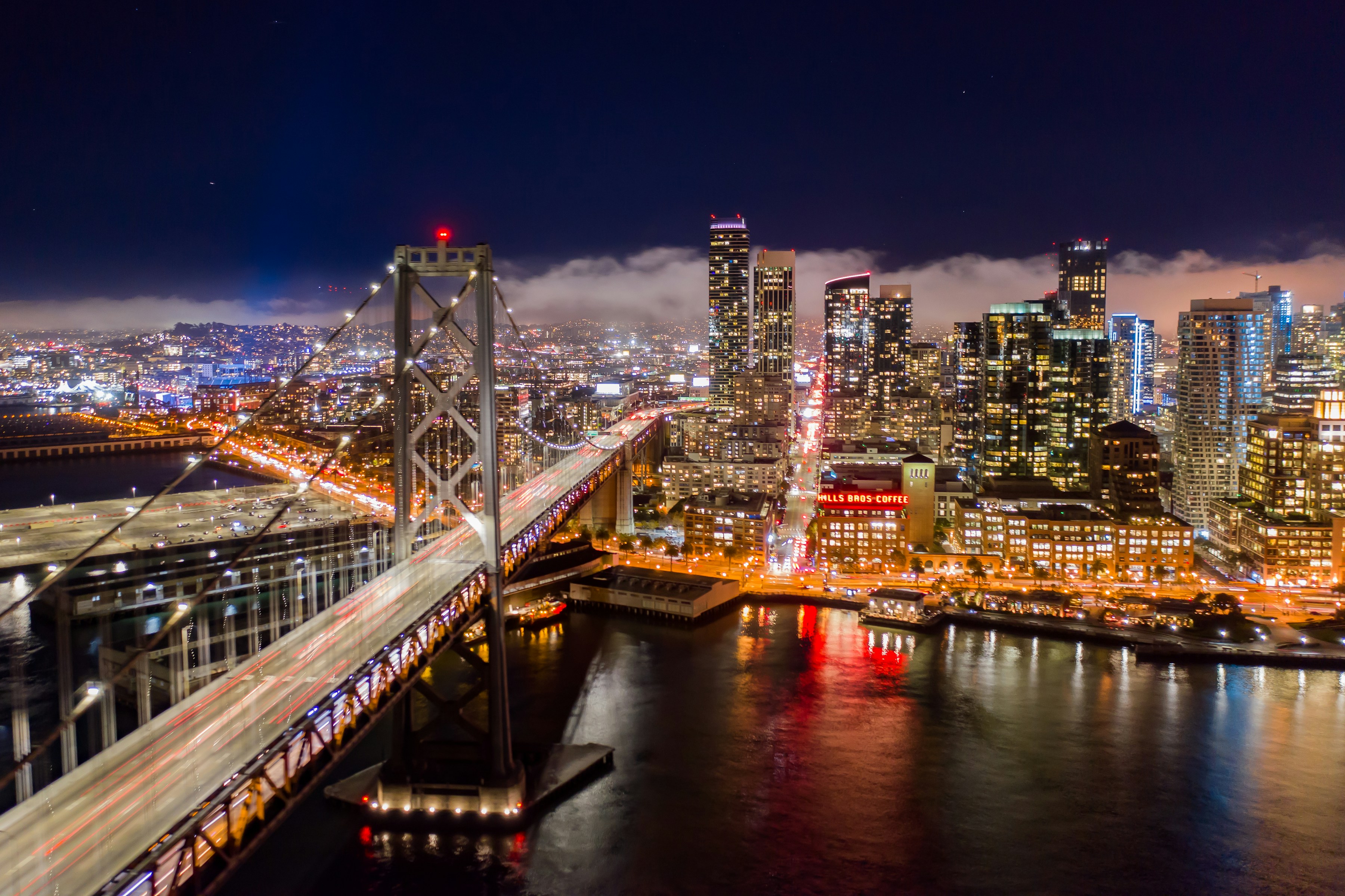 San Francisco at night, the Bay Bridge, and downtown skyline